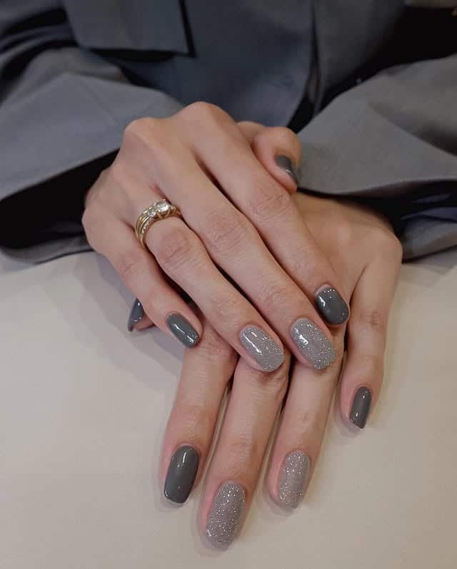 22. Dark Grey Oval Nails with Silver Shimmer Accents - simple grey nail ideas