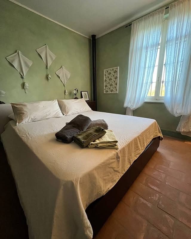 21. Rustic Light Green Bedroom with Plaster Walls - light green bedroom ideas