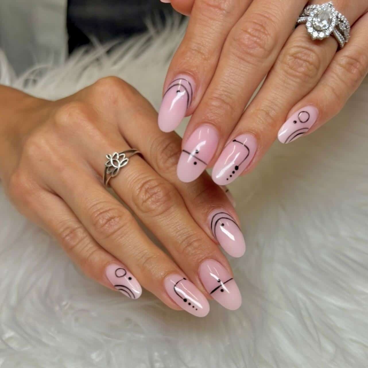 17. Almond Pink Nails with Black Graphic Line Art - simple line nail ideas
