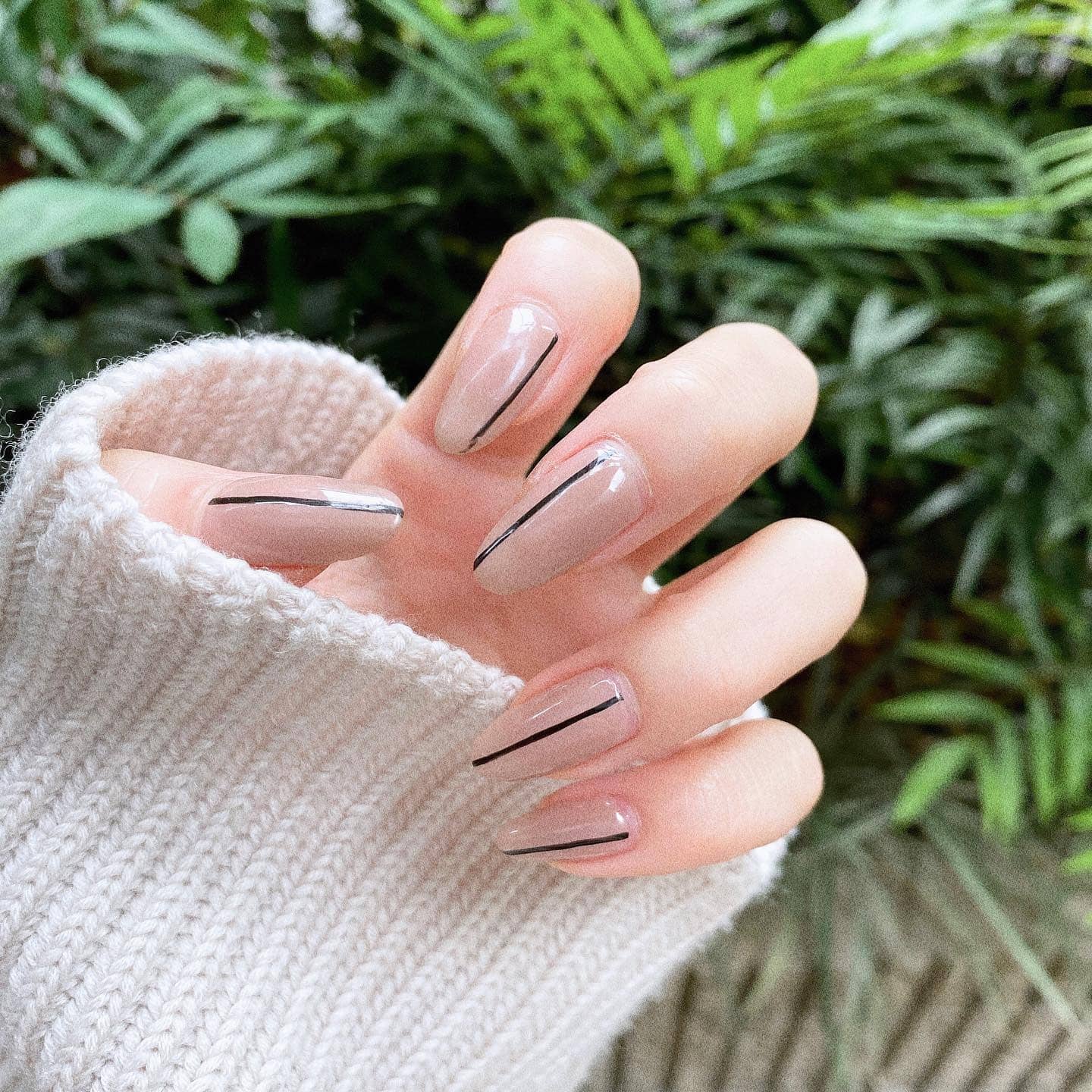 21. Long Nude Coffin Nails with Black Center Lines - simple line nail ideas