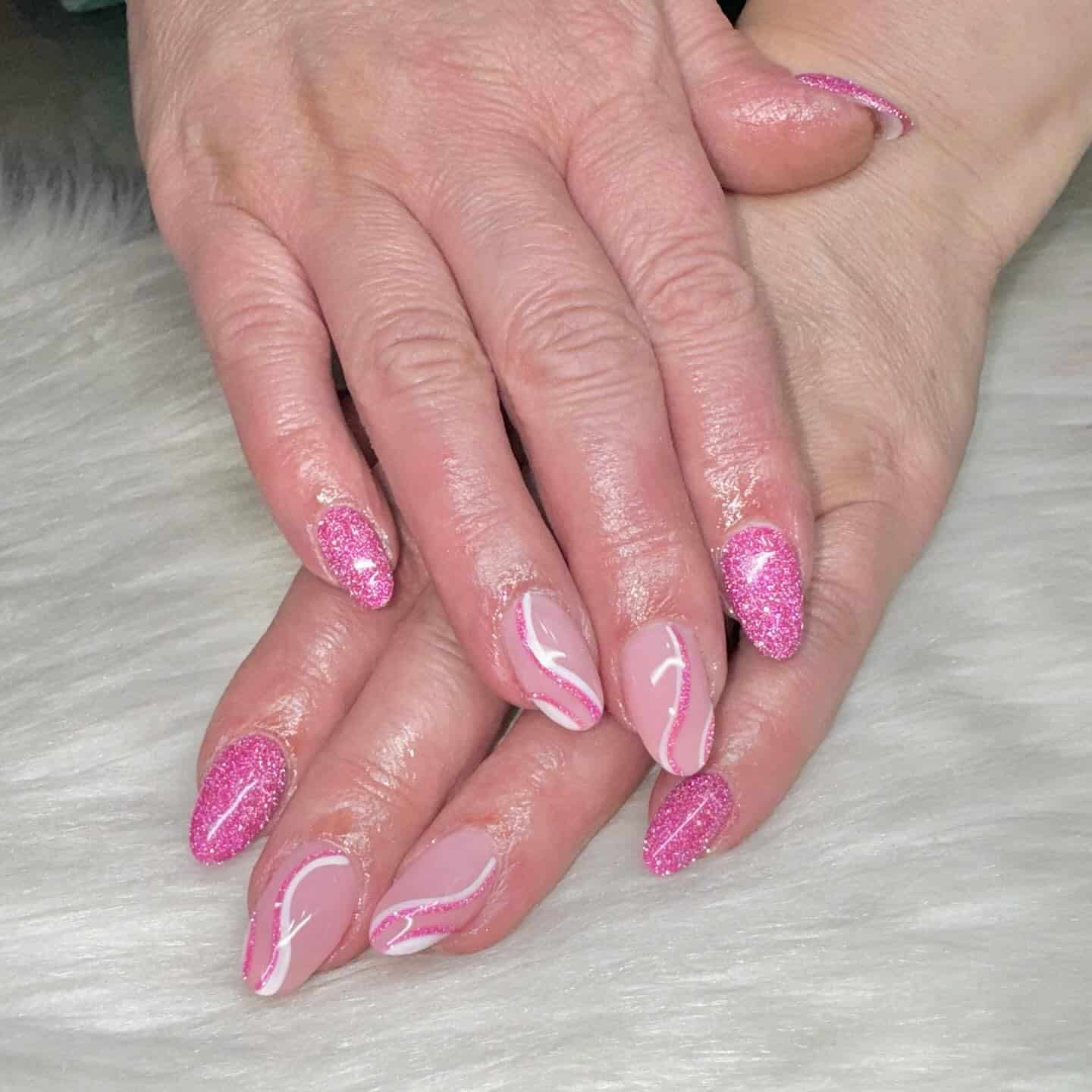 1. Pink Glitter Almond with Soft Swirl Accents - sparkly pink nail ideas