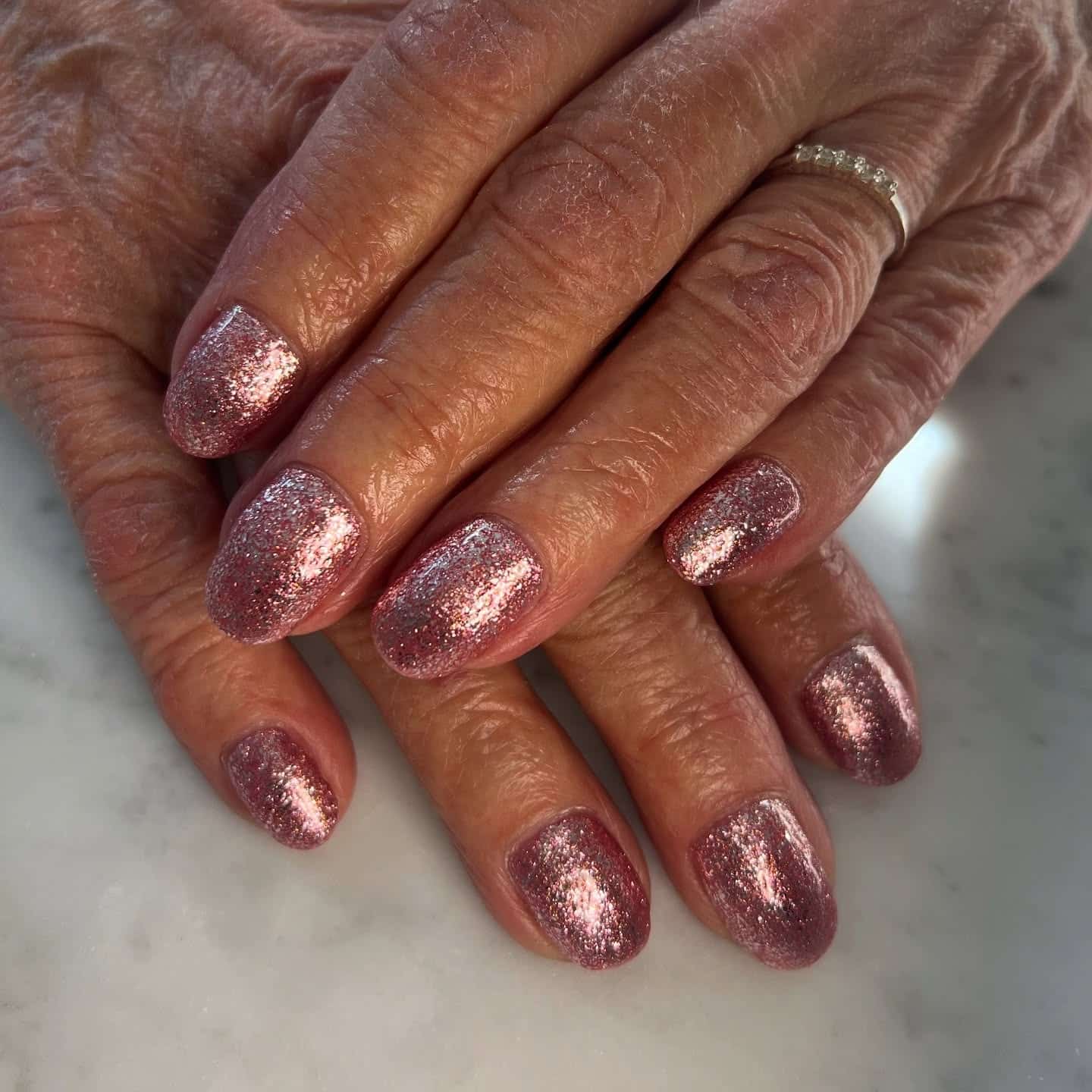 15. Mauve Pink Sparkle Short Oval - sparkly pink nail ideas