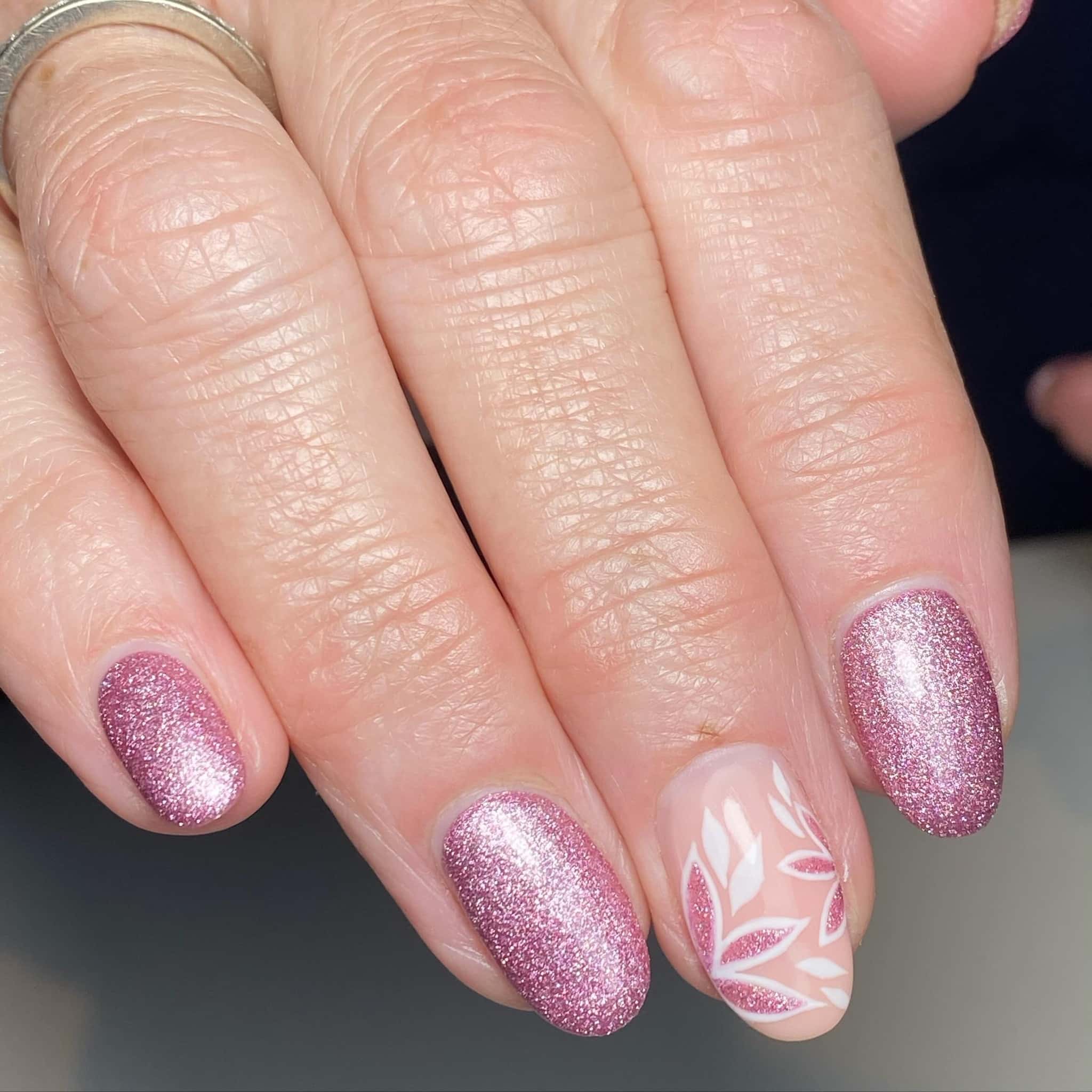 17. Rose Pink Glitter Almond with Leaf Accent - sparkly pink nail ideas
