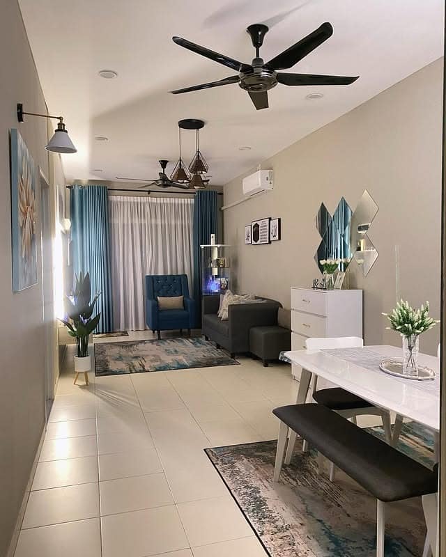 16. Streamlined Open Living with Soft Blue Accents - tiny living room ideas