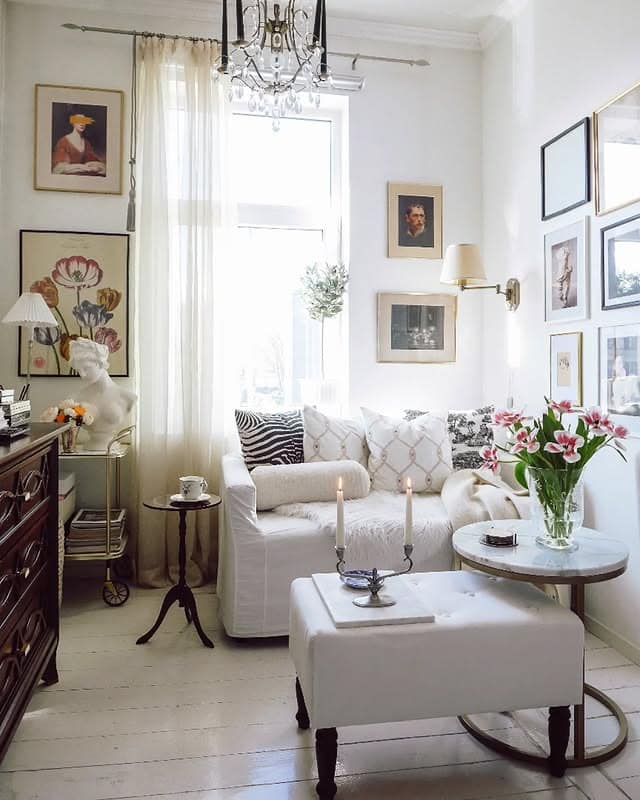 17. Gallery-Style Living with Refined White Palette - tiny living room ideas
