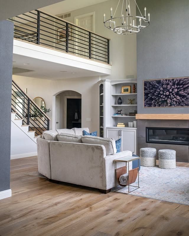 5. Open-Concept Living Room with Warm Oak Plank Flooring - living room floor ideas