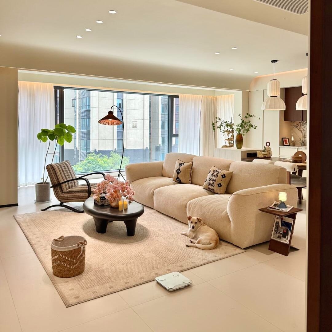 7. Soft Neutral Living Room with Cream Porcelain Tile Floors - living room floor ideas