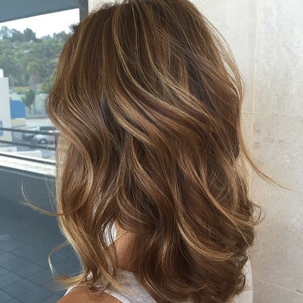 22. Shoulder-Length Light Brown Waves with Warm Highlights - Light Brown Hair with Highlights