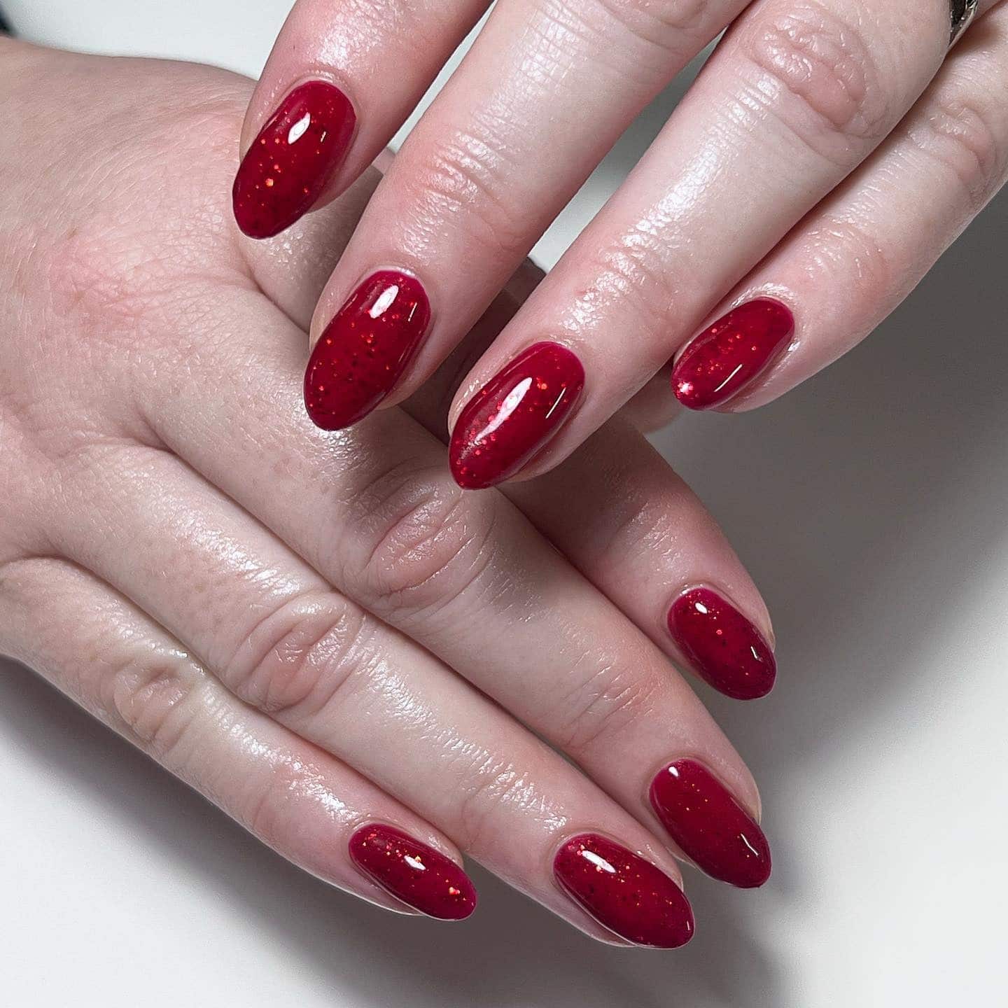 4. Deep Red Micro-Glitter Almond Nails - sparkly red nail ideas