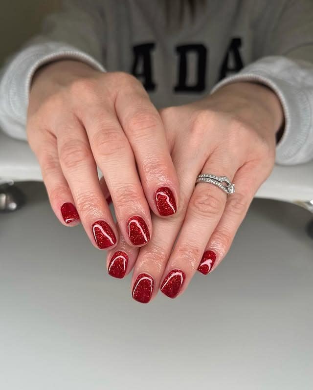 5. Holiday Red Glitter Accent Nails - sparkly red nail ideas