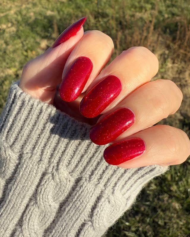 11. Red Sparkle Almond Winter Nails - sparkly red nail ideas