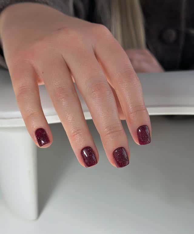 20. Deep Wine Sparkle Short Nails - sparkly red nail ideas
