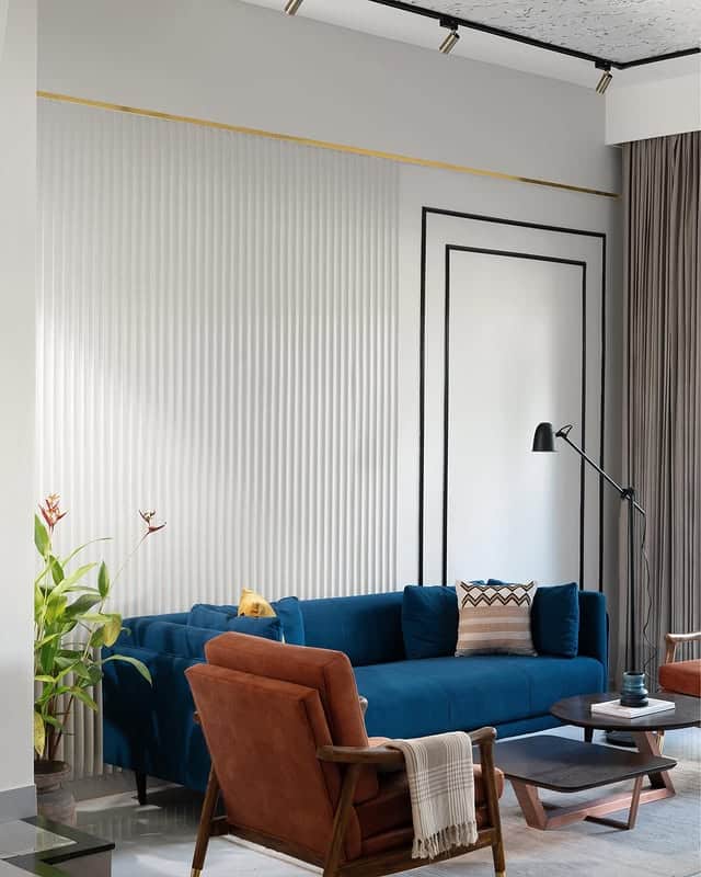 8. Modern Blue Sofa with Soft Grey Surroundings - blue and grey living room ideas