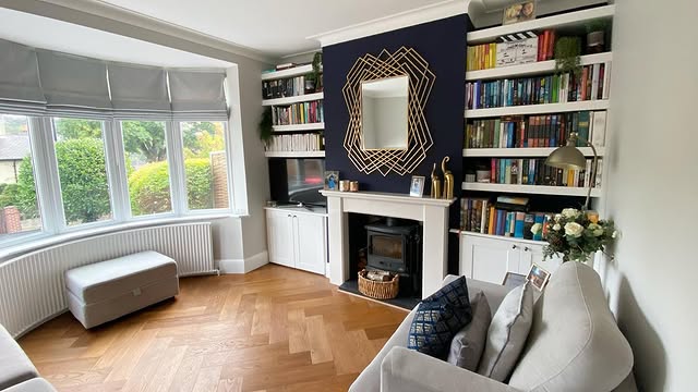 9. Blue Feature Wall with Grey Built-Ins - blue and grey living room ideas