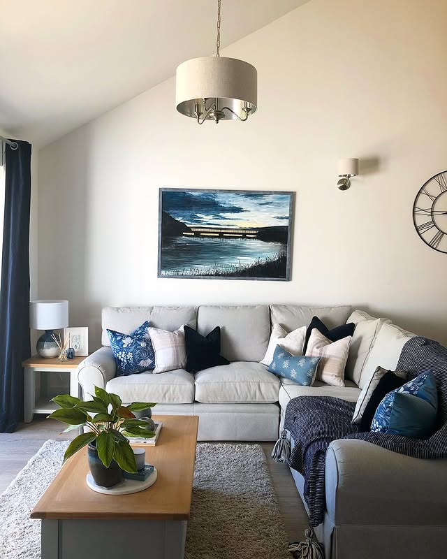 18. Relaxed Grey Living Room with Layered Blue Textiles - blue and grey living room ideas