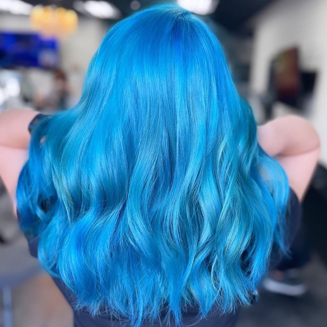 9. Vivid Cyan Long Wave Style - Blue Hair Color
