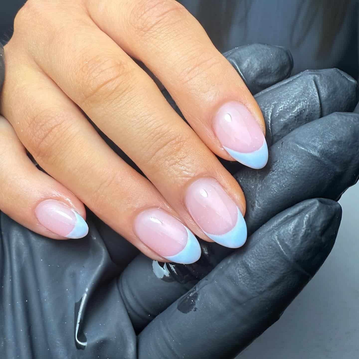 17. Baby Blue French Tips on Short Almond Nails - spring french tip nail ideas