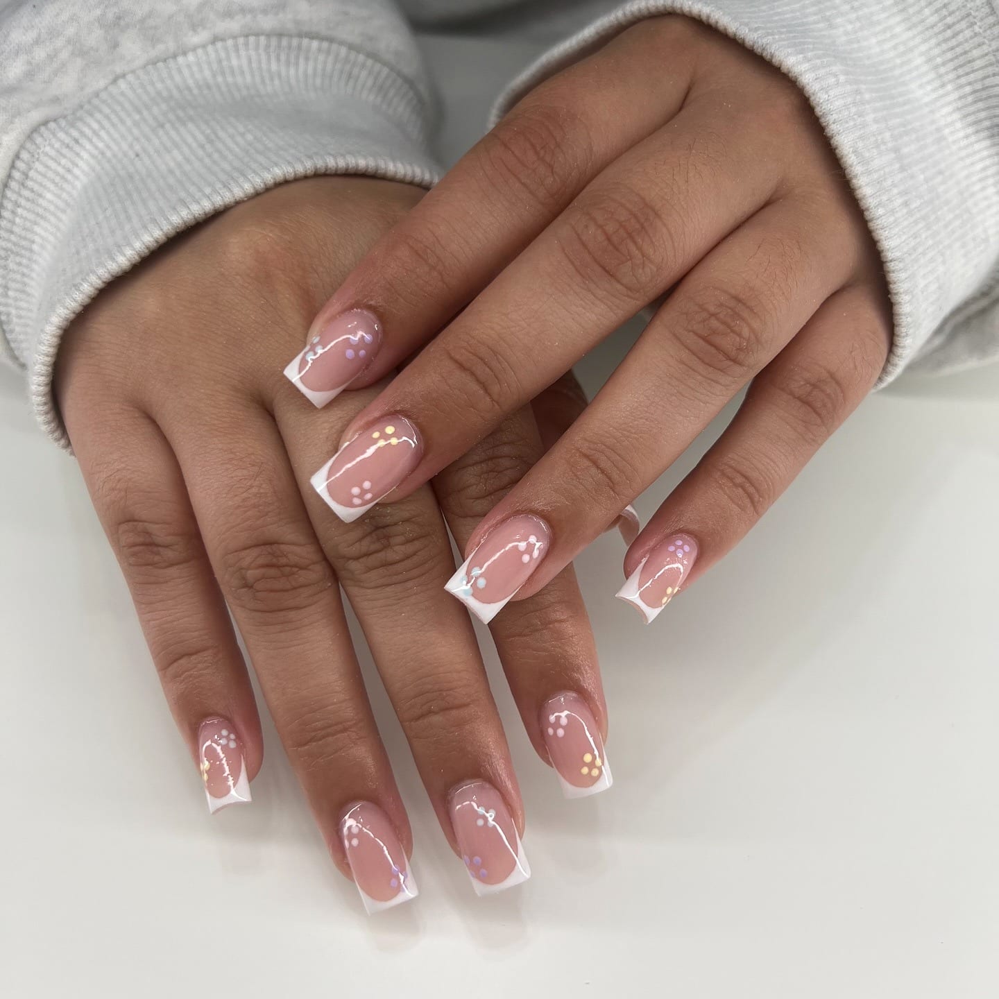 20. White Micro French Tips with Pastel Dot Accents - spring french tip nail ideas