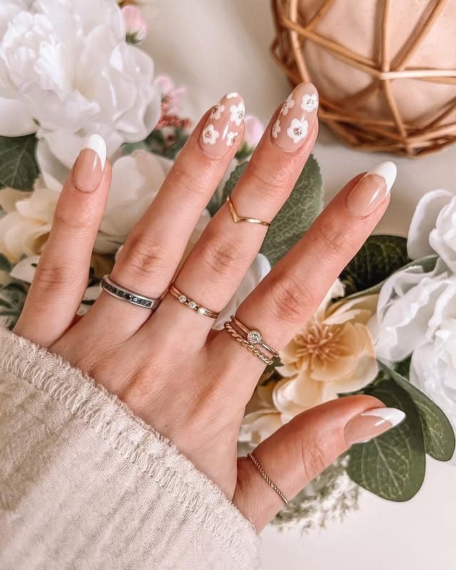 21. White Floral Almond French Tips - spring french tip nail ideas