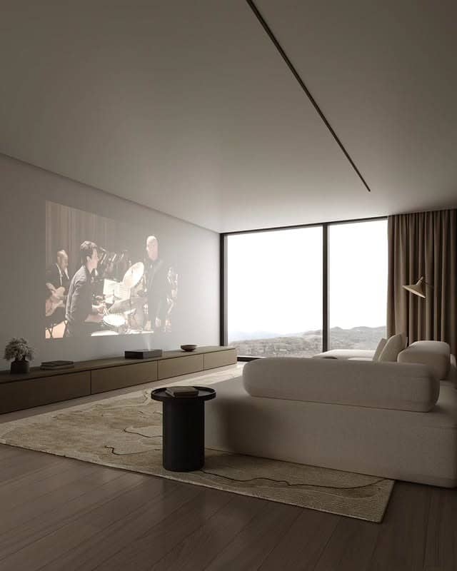 10. Soft Gray Media Room with Subtle Luxury - gray living room ideas