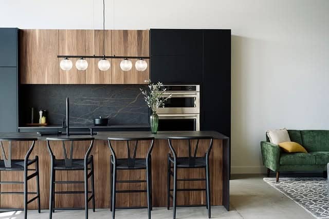 1. Modern Black & Warm Wood Kitchen with Sculptural Lighting - black kitchen ideas
