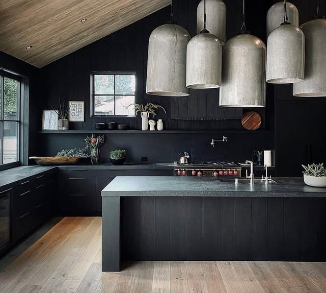 5. Textured Black Kitchen with Concrete Pendants - black kitchen ideas