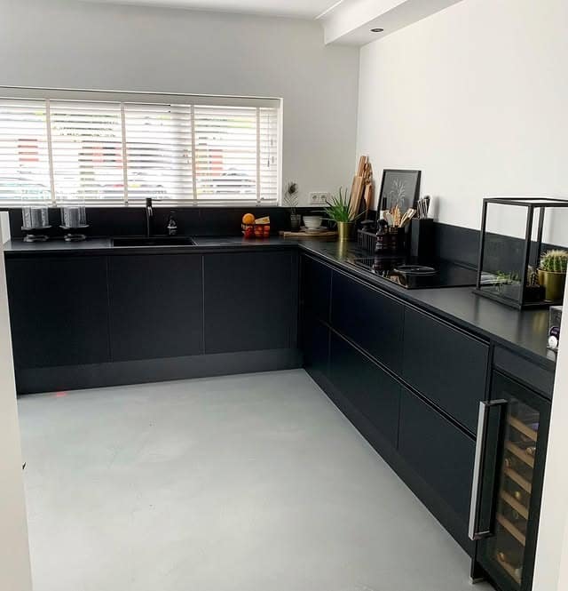 6. Matte Black Kitchen with Minimal Styling - black kitchen ideas
