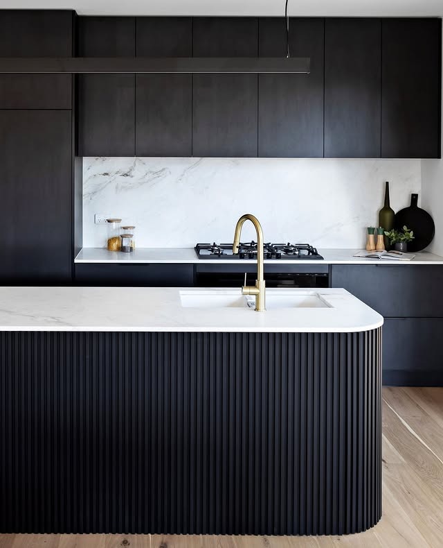 19. Black Kitchen with White Backsplash and Brass Faucet - black kitchen ideas