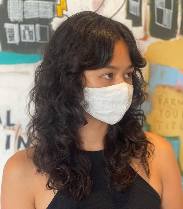 19. Natural Wavy Cut with Curtain Bangs in Deep Brown - Wavy Hair with Bangs