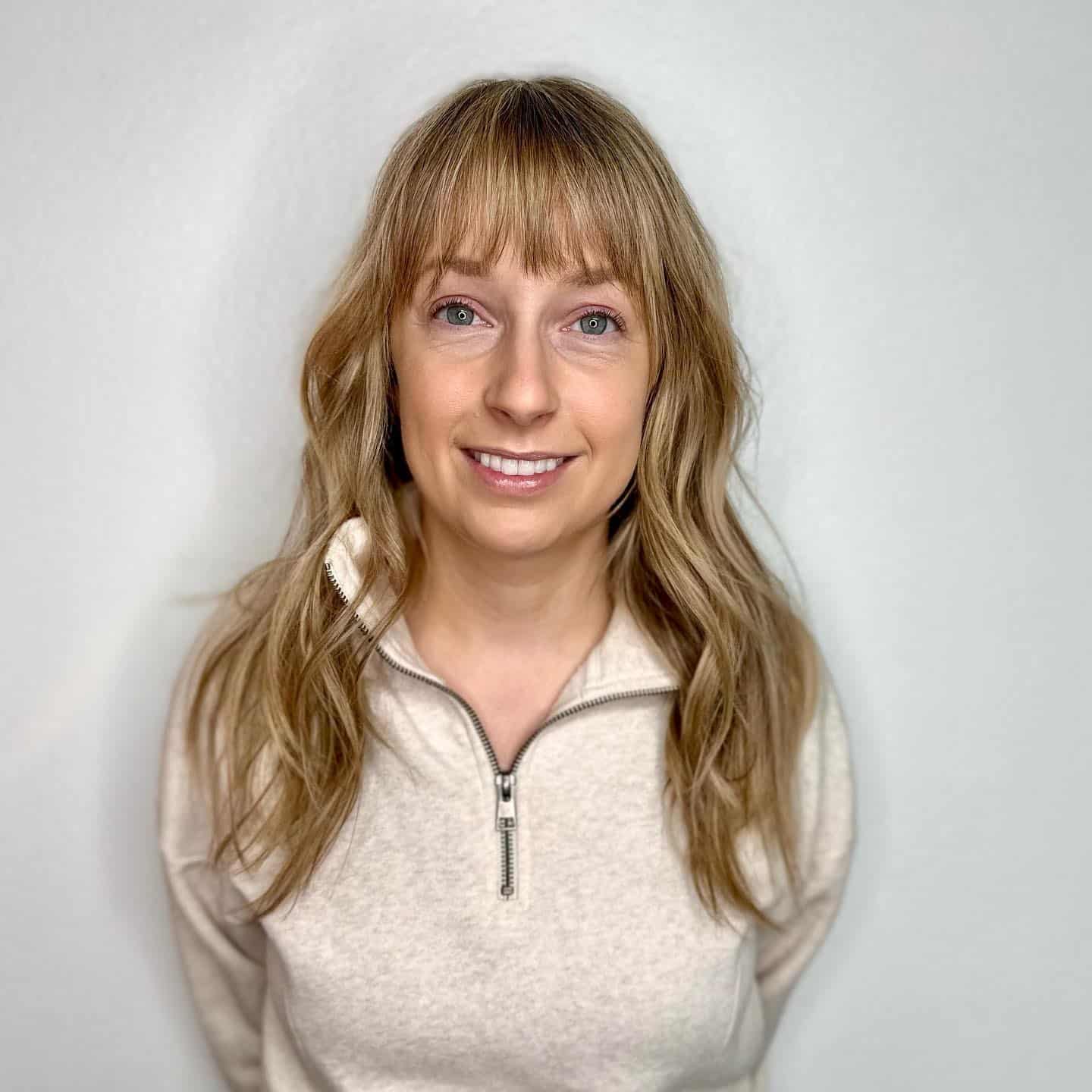 21. Soft Long Waves with Wispy Bangs in Sandy Blonde - Wavy Hair with Bangs