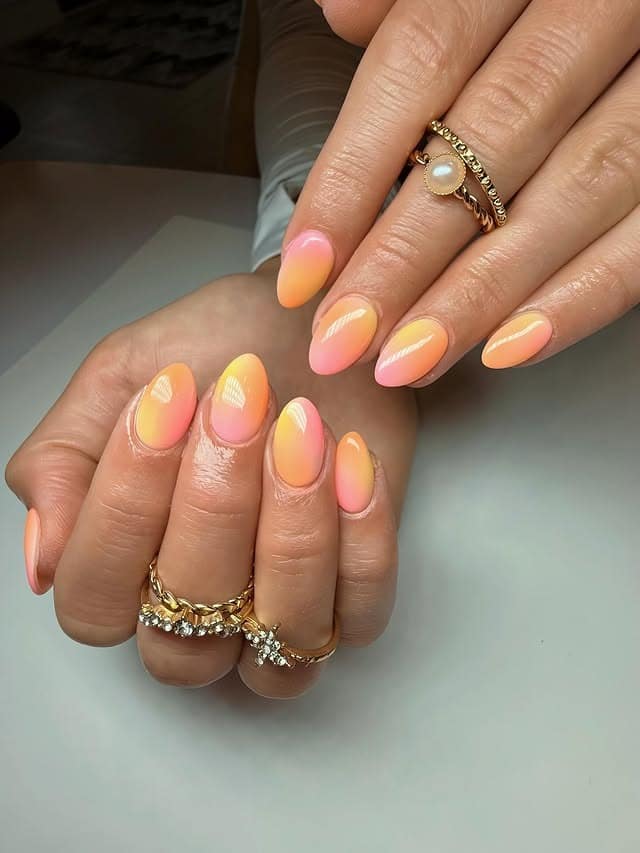 15. Peach Pink Sunset Almond Nails - sunset nail ideas