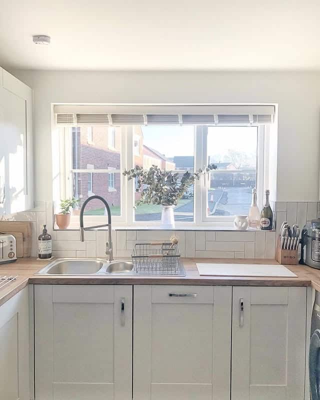 1. Soft Neutral Sink Wall with Natural Wood Accents - kitchen window ideas