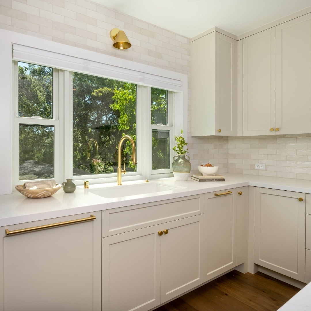 5. Classic Cream Kitchen with Gold Hardware - kitchen window ideas