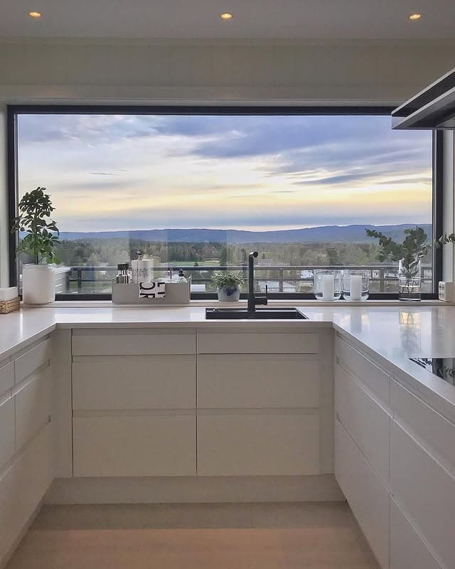 7. Modern Minimal Kitchen with Panoramic View - kitchen window ideas