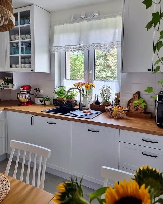 9. Scandinavian-Inspired White Kitchen with Wood Counters - kitchen window ideas