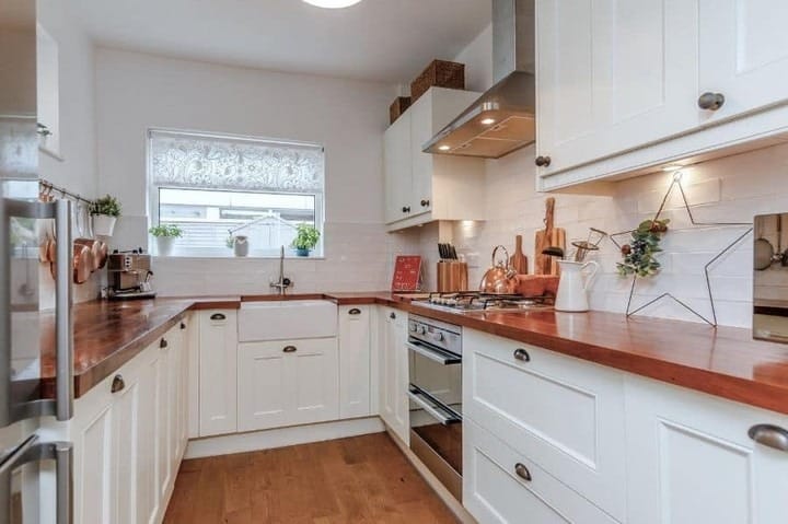 16. Modern Dark Kitchen with Slimline Window - kitchen window ideas