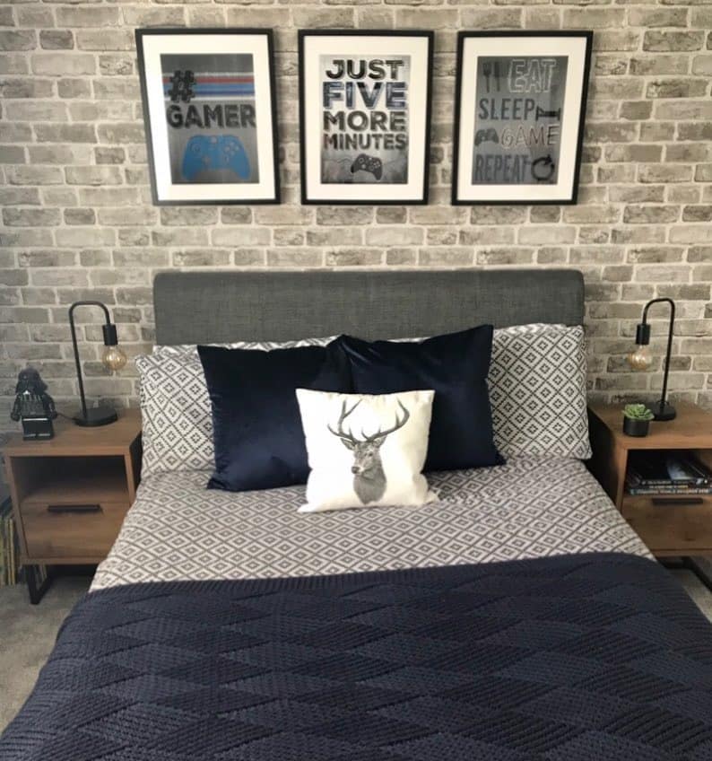 8. Industrial-Inspired Bedroom with Gray Brick and Navy Accents - navy blue and gray bedroom ideas
