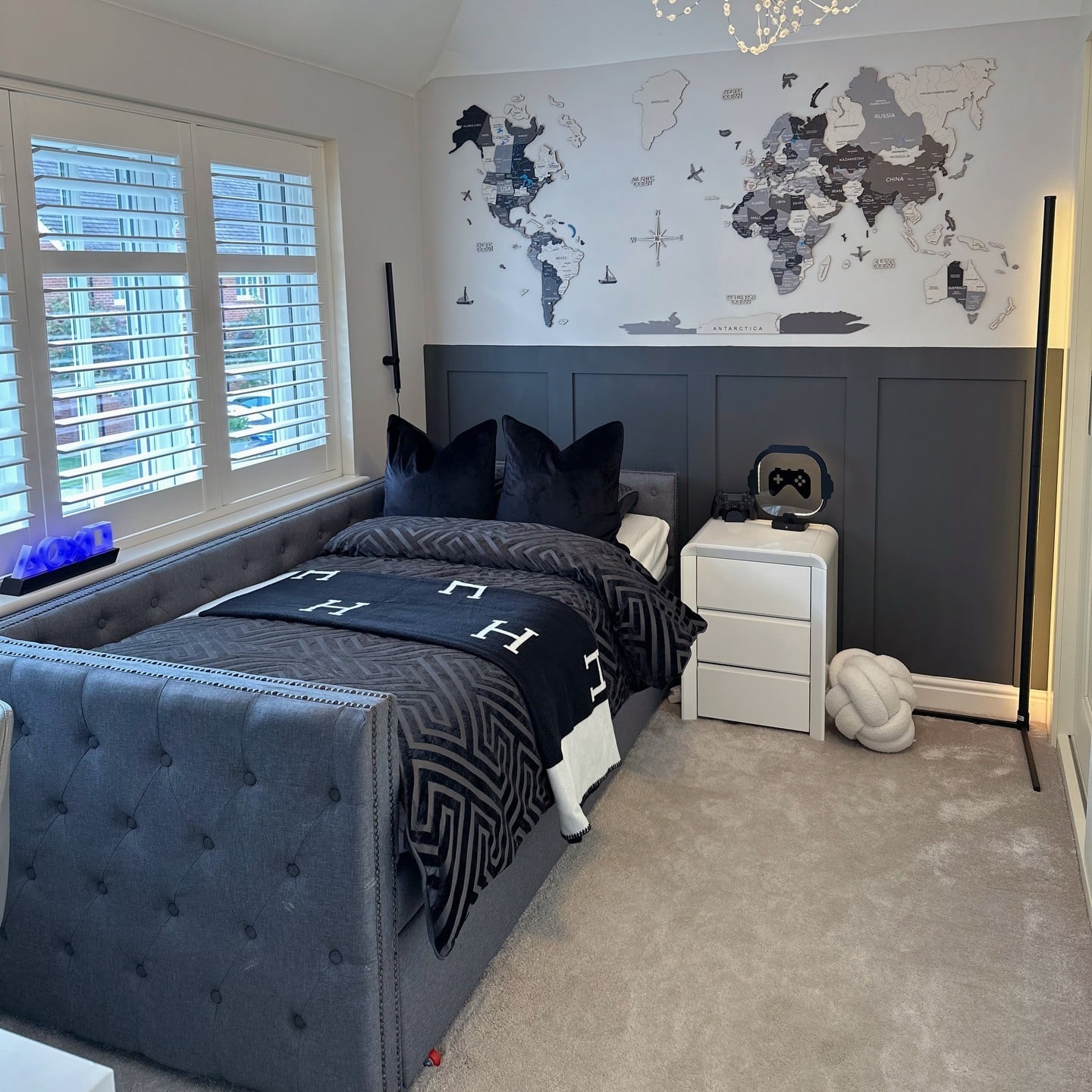16. Youth Bedroom with Gray Paneling and Navy Accents - navy blue and gray bedroom ideas