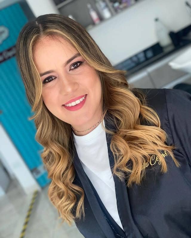 2. Honey Ribbon Highlights with Polished Waves - Honey Hair Color