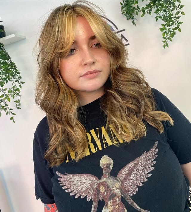 11. Honey Gold Layers with Curtain Bangs - Honey Hair Color