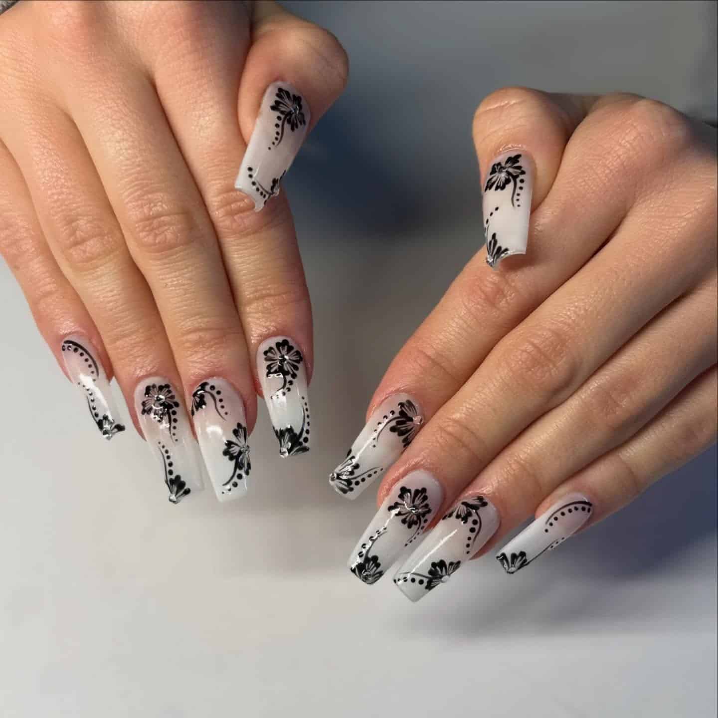 1. Tropical Monochrome Floral Coffin Nails in Milky White and Black - tropical flower nail ideas