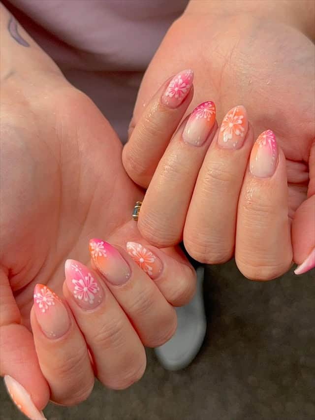 4. Peach Sunset Tropical Floral Short Nails in Nude and Coral - tropical flower nail ideas