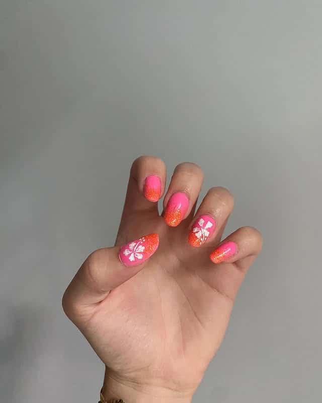 9. Sunset Ombre Tropical Flower Short Nails in Pink and Orange - tropical flower nail ideas