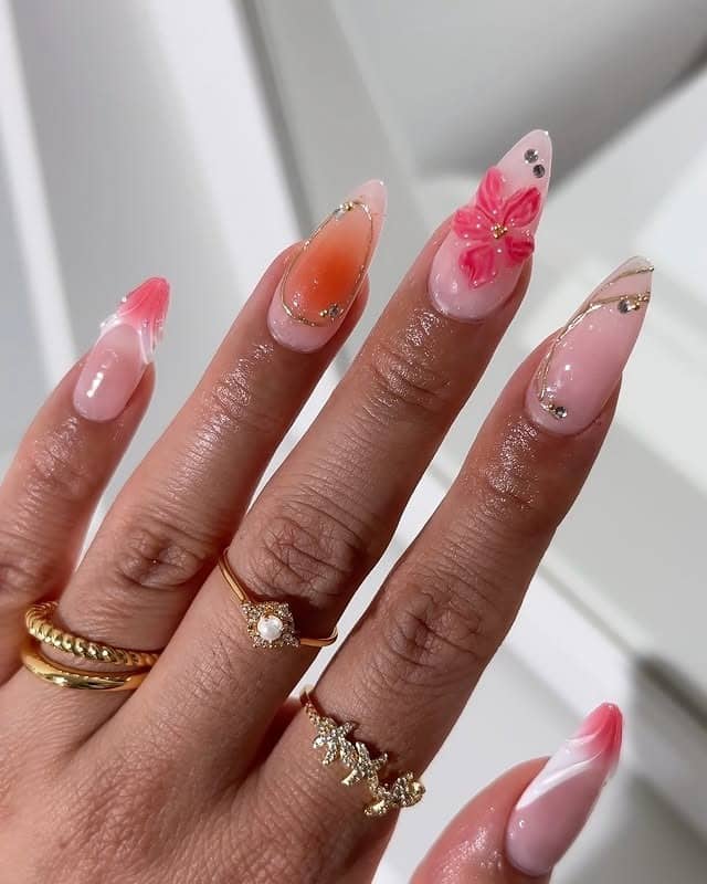 10. Glossy Tropical Floral Almond Nails in Soft Pink - tropical flower nail ideas