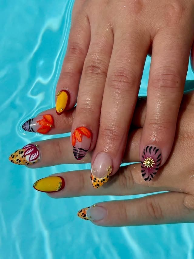 15. Tropical Garden Almond Nails in Yellow, Coral, and Nude - tropical flower nail ideas