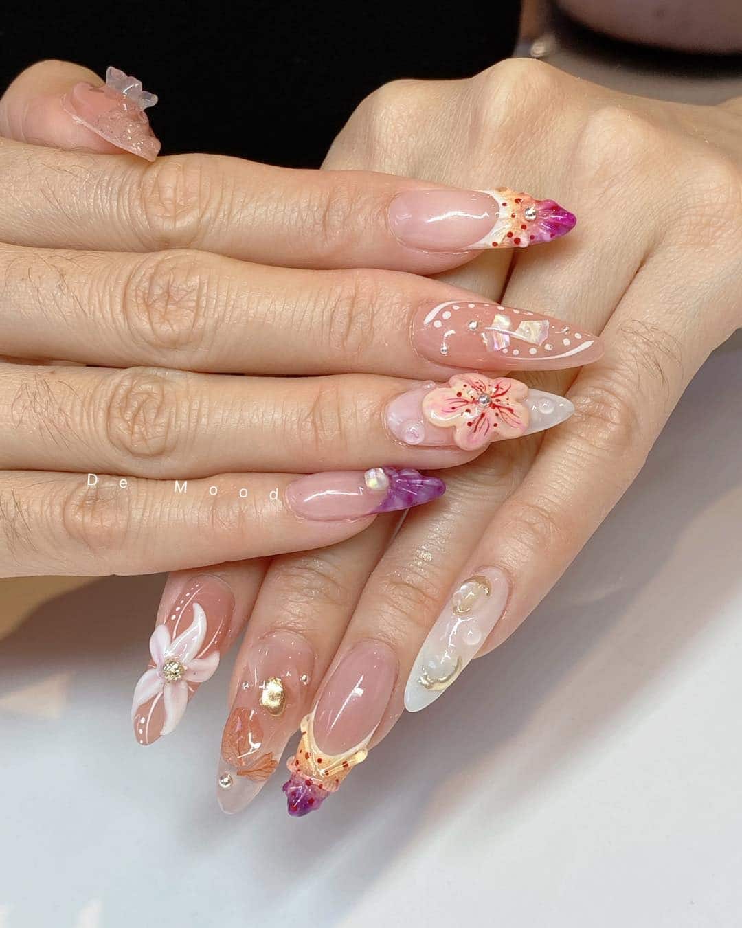 16. Sculpted Tropical Flower Almond Nails in Blush and Crystal Clear - tropical flower nail ideas