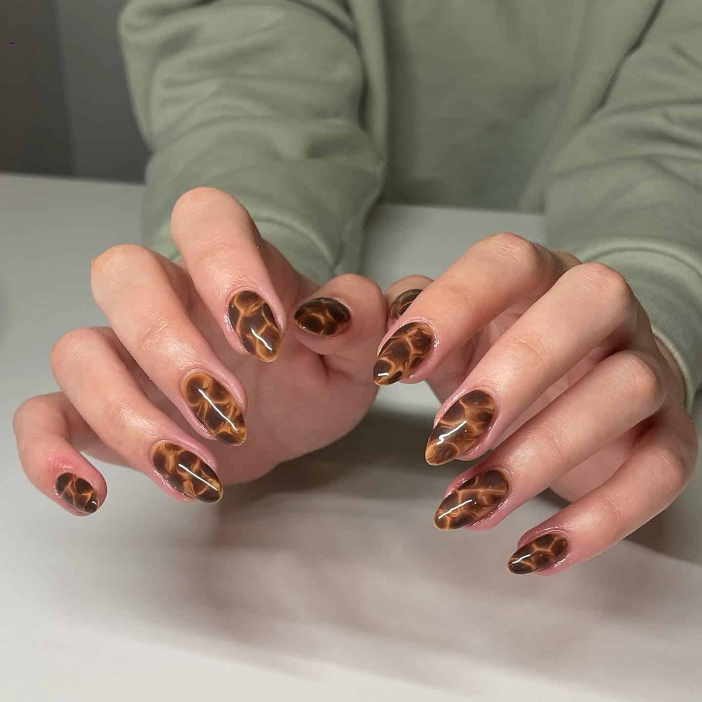 6. Warm Amber Tortoiseshell Nails with Fluid Patterning - turtle nail ideas