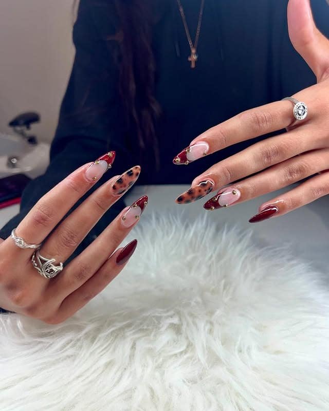 9. Mixed Design Tortoiseshell Nails with Deep Red Accents - turtle nail ideas