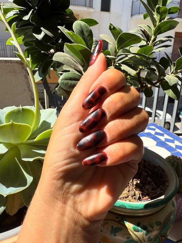 10. Sunlit Deep Brown Tortoiseshell Nails - turtle nail ideas