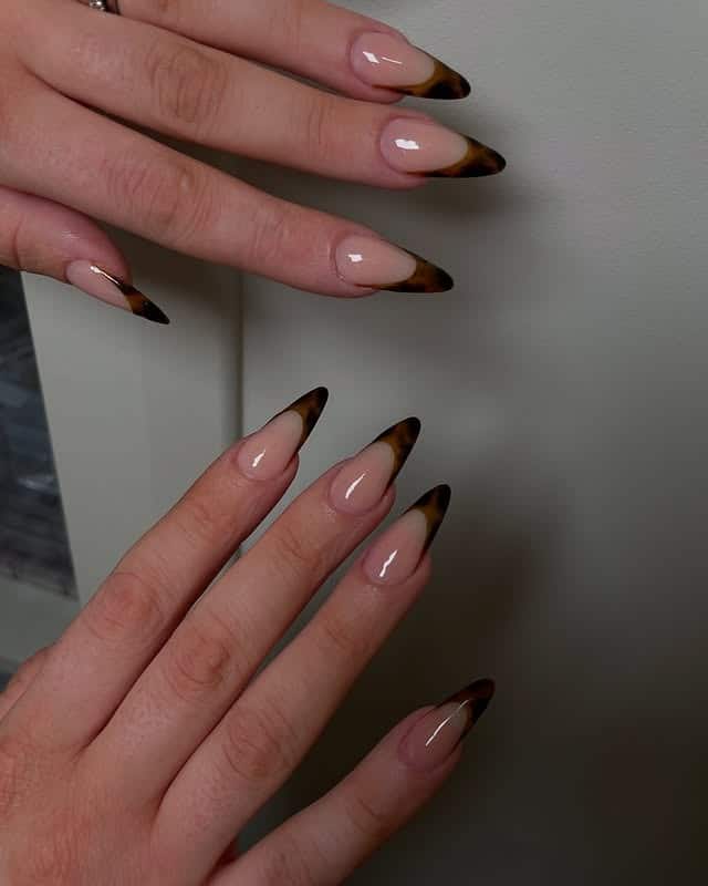 15. Soft Almond Nude Nails with Tortoiseshell Tips - turtle nail ideas